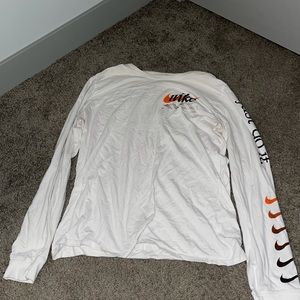 Nike white-orange long sleeved M shirt for $31.